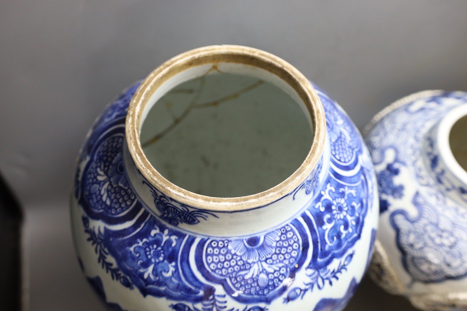 A large Chinese blue and white jar and cover and a blue and white jar and cover, 19th-century and later. Largest 44cm